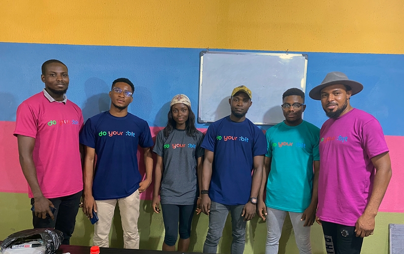 D'Blessing Agapekind et al. posing for a photo