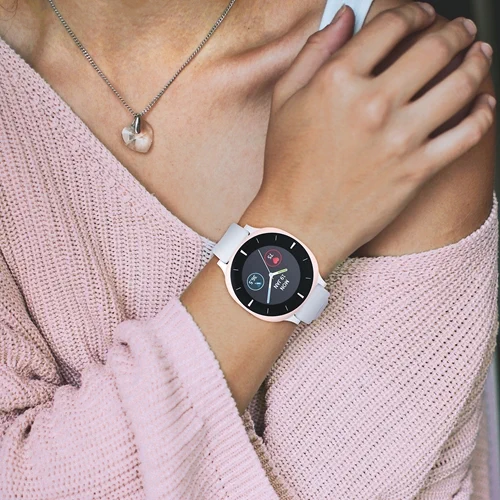 Women with white watch on her arm from August International 